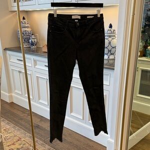 Skinny girl black straight leg Jean.  Fringe on bottom.